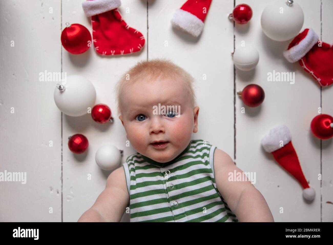happy cute baby celebrating their first christmas Stock Photo Alamy