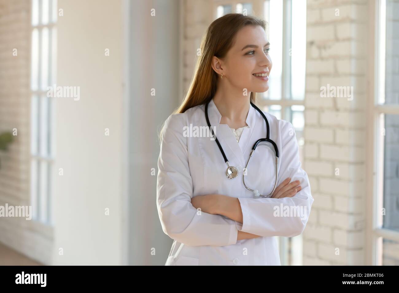 Smiling doctor gp in white hi-res stock photography and images - Alamy