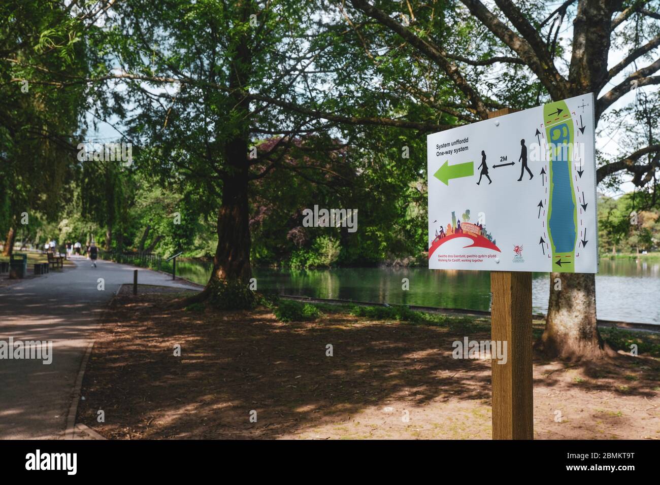 Roath, Cardiff. Covid-19 signs illustrating social distancing measures in Roath Park, Cardiff. Stock Photo