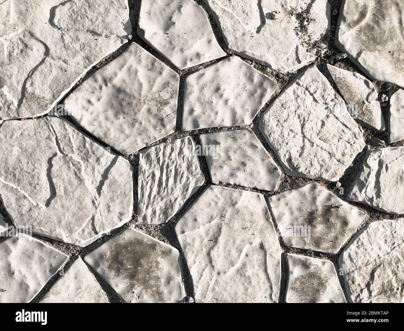 Bright gray stone background. Backdrop made of natural material. Textured surface Stock Photo