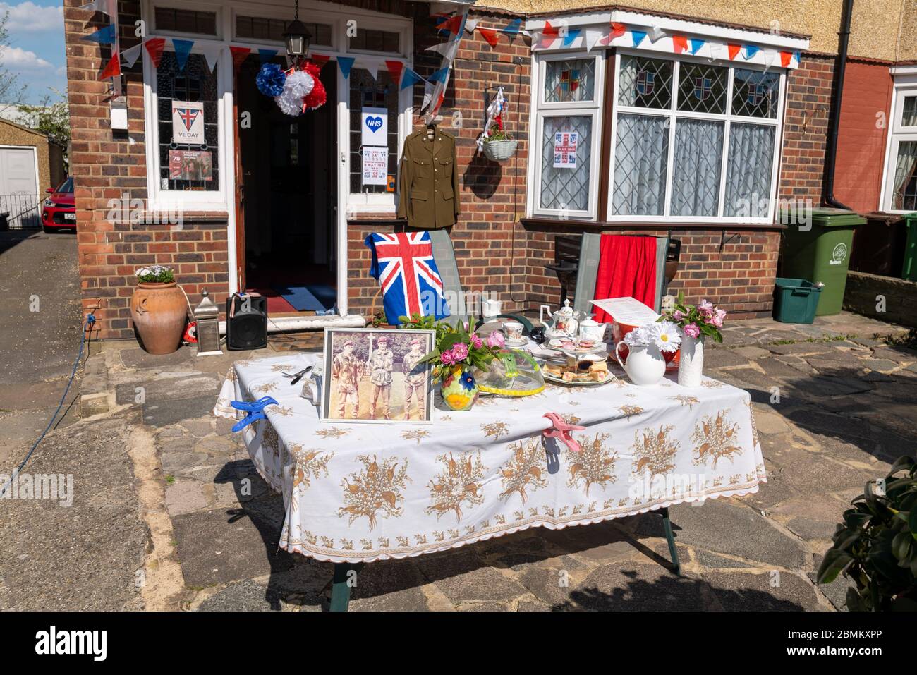 A table outside a house in North Cheam Surrey, dressed with war time  memorabilia celebrating the 75th Anniversary of Victory in Europe. May 2020. Stock Photo