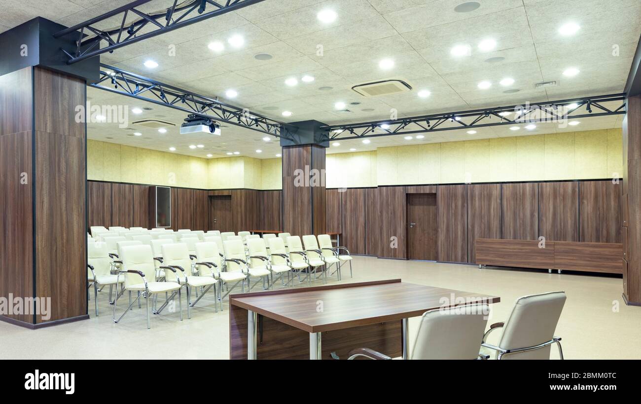 View from table for speaker to audience with chairs Stock Photo