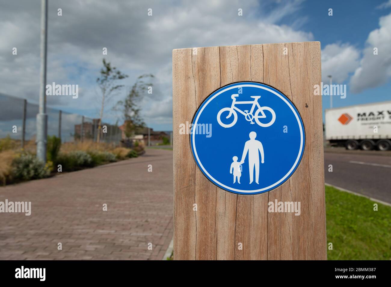 Wooden sign indicating cycle and footpath aWallasey docks Wirral August 2019 Stock Photo
