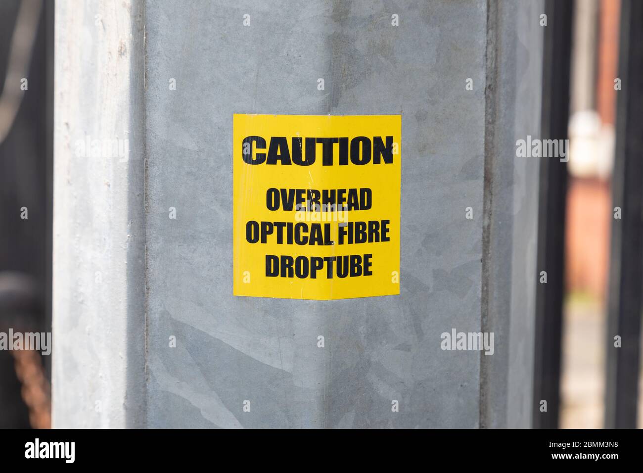 caution sticker on optical fibre pole wallasey wirral August 2019 Stock Photo