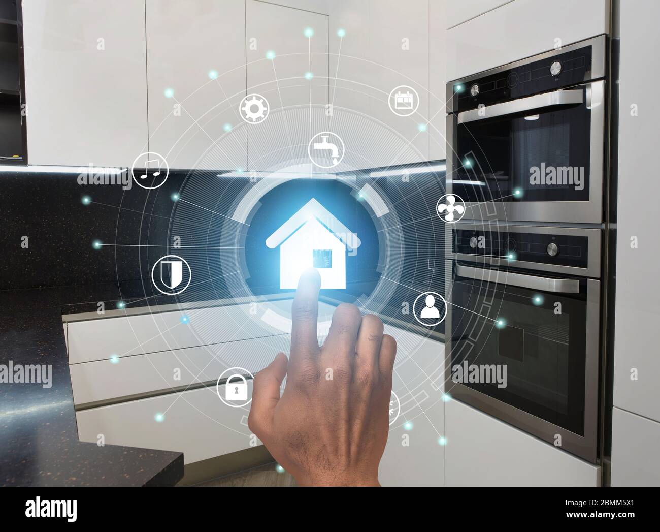 Smart technologies. Millennial guy using modern home control system in kitchen, collage with icons on virtual screen Stock Photo