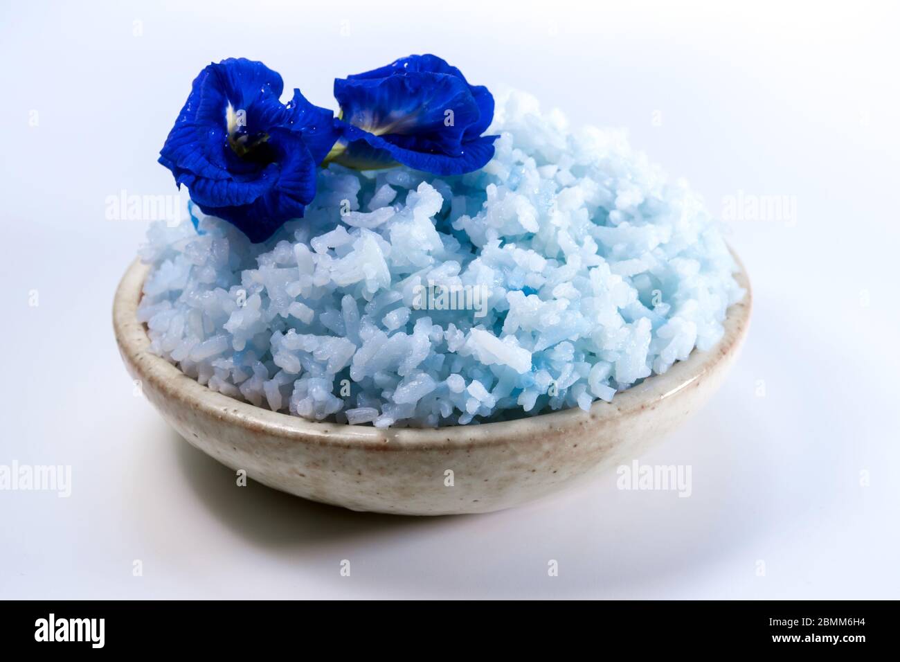 Blue color cooked rice by color of butterfly pea flower Stock Photo - Alamy