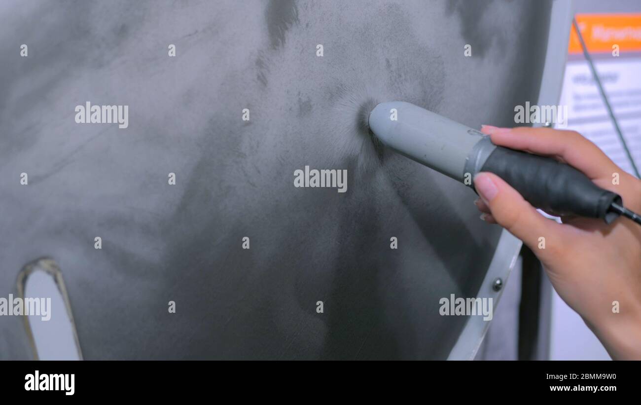 Interactive exposition in science museum woman with stick