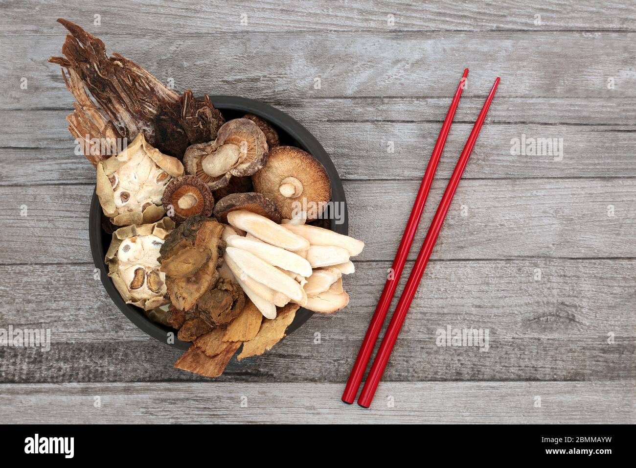 Chinese herbs used in traditional ancient herbal medicine with red