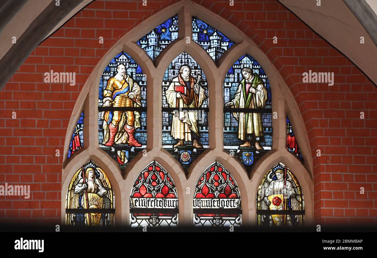 Stralsund, Germany. 10th May, 2020. The window in the east has a stained glass from the end of the 19th century showing Martin Luther (M), King Gustav Adolf II of Sweden and the Stralsund reformer Christian Ketelhot. For the first time since mid-March, Sunday services are held in numerous churches in Mecklenburg-Vorpommern. Participants must observe strict rules of hygiene. Credit: Stefan Sauer/dpa/Alamy Live News Stock Photo