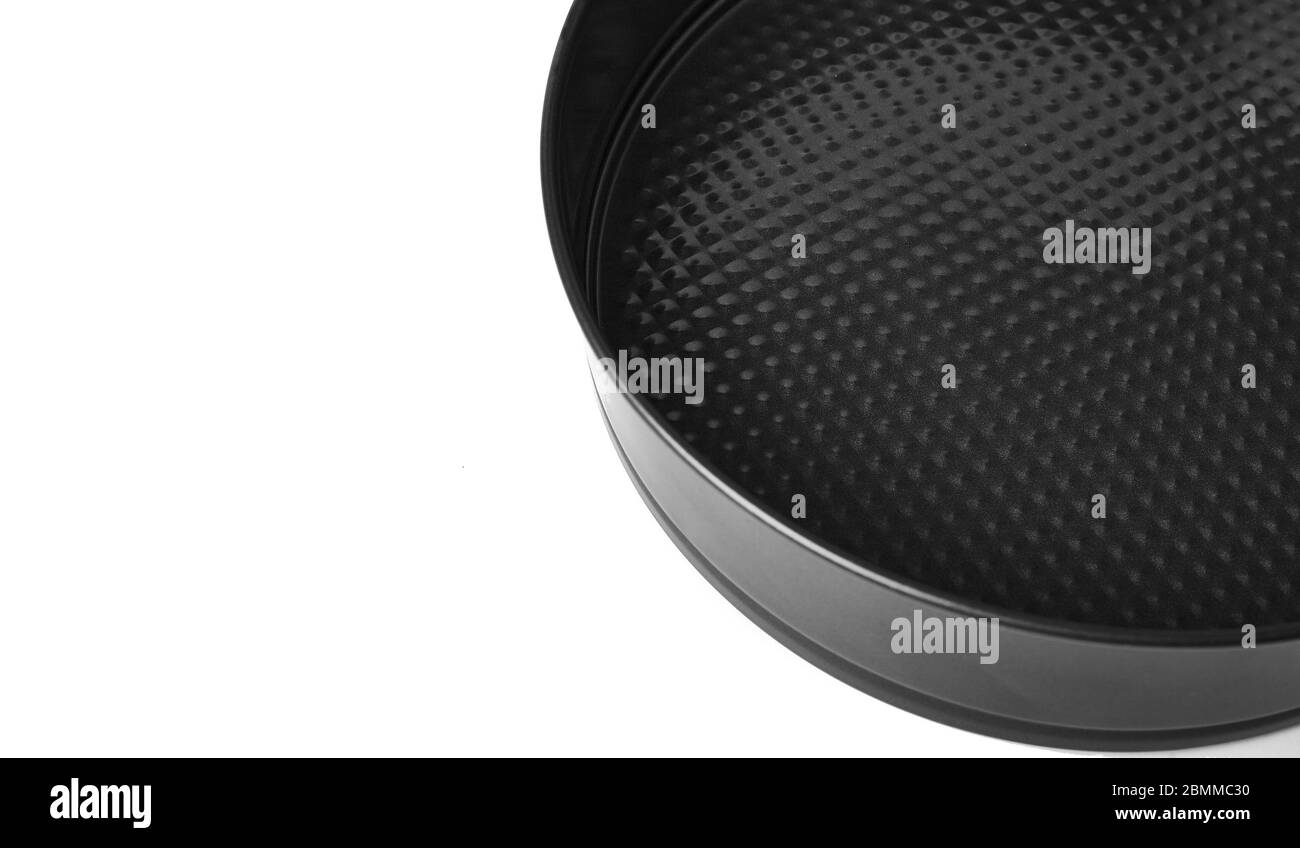 Round metal baking dish, isolated. Baking form with removable bumpers Stock Photo Alamy