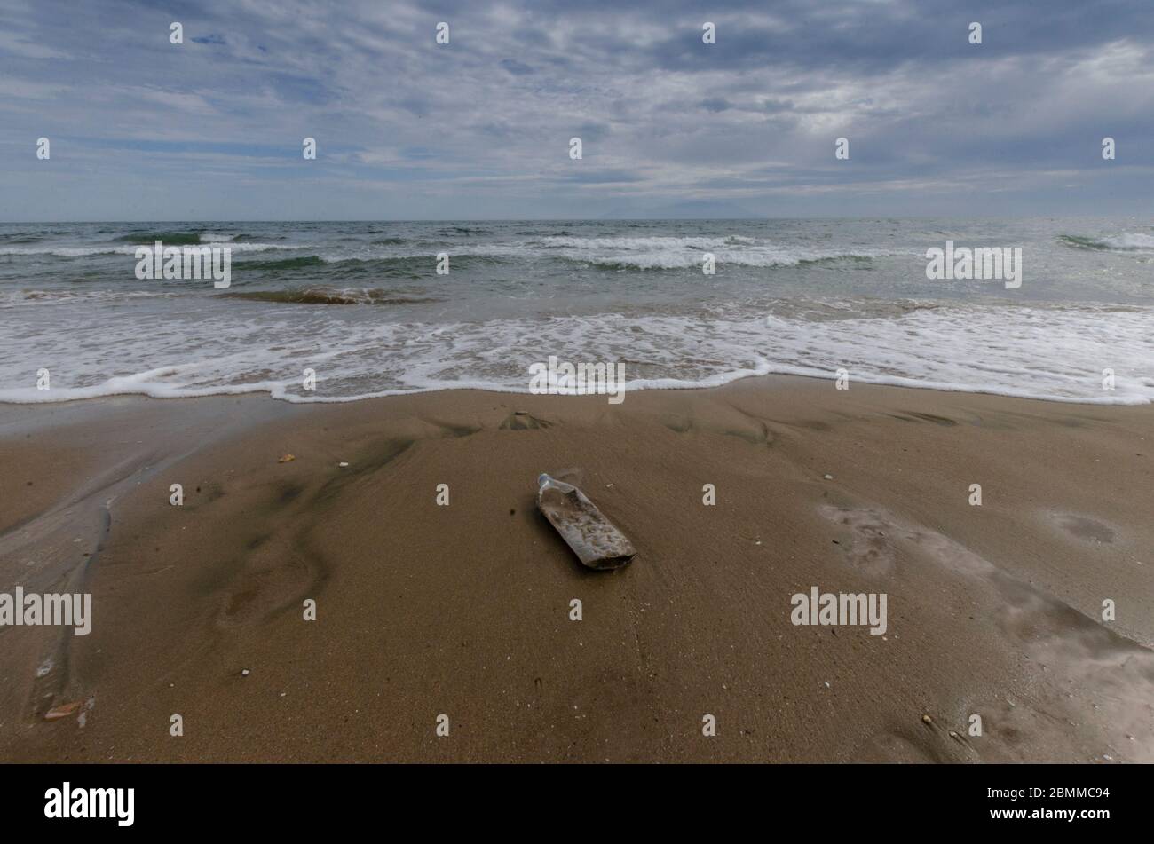 A plastic bottle on a beach in Alexandroupoli Evros Greece Stock Photo