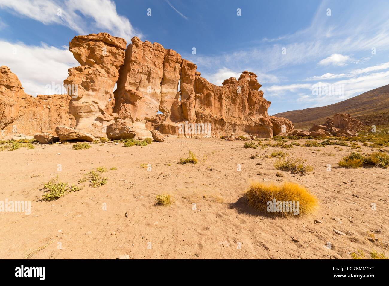 Eroded and bizarre formed orange colored rocks and boulders in Valle de Rocas, or Stone Valley, in the desert of southern Bolivia Stock Photo
