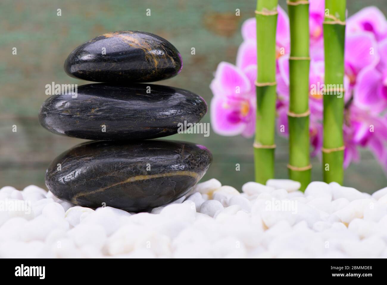 Japanese zen garden with stacked stones and bamboo Stock Photo