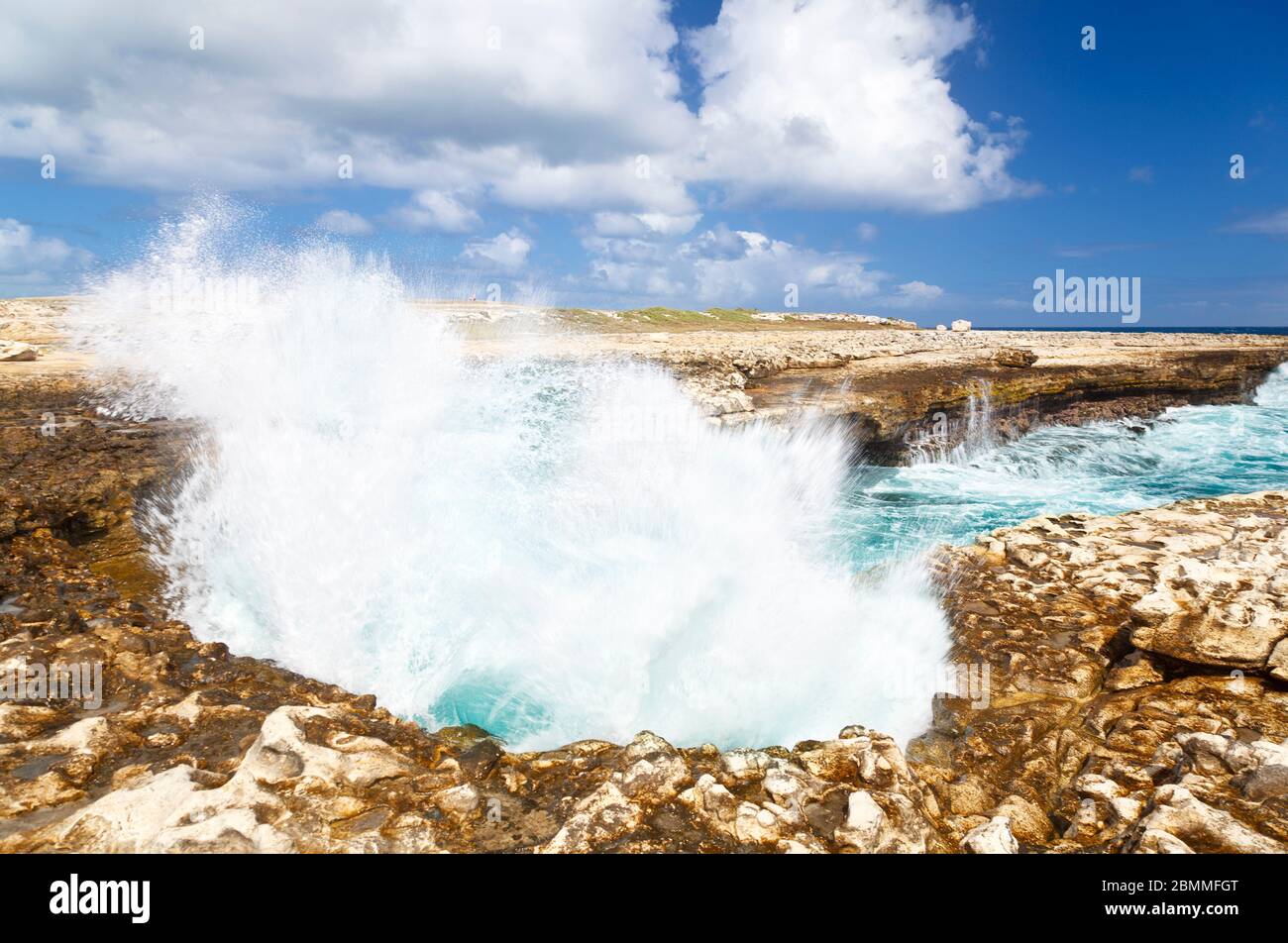 Devils Bridge in the northeast of Antigua where the waves of the Atlantic have eroded a natural arch. Stock Photo