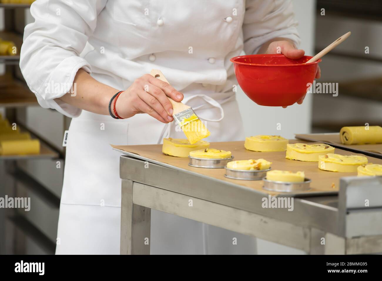 Bakery Making Baker working in bakery making tradition french bread and pastry Stock ...