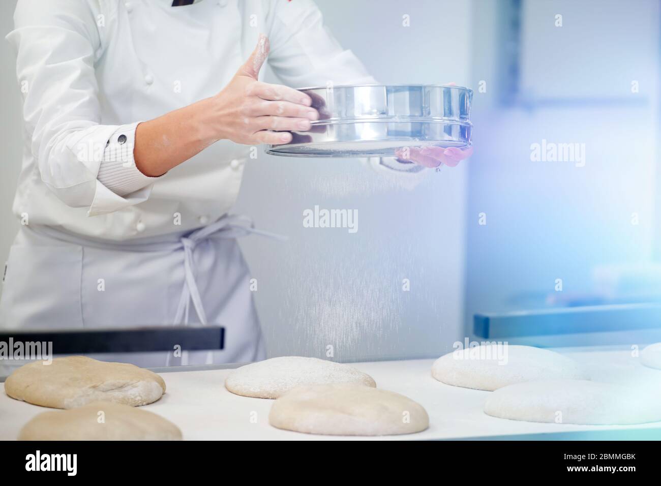 Bakery Making Baker working in bakery making tradition french bread and pastry Stock ...
