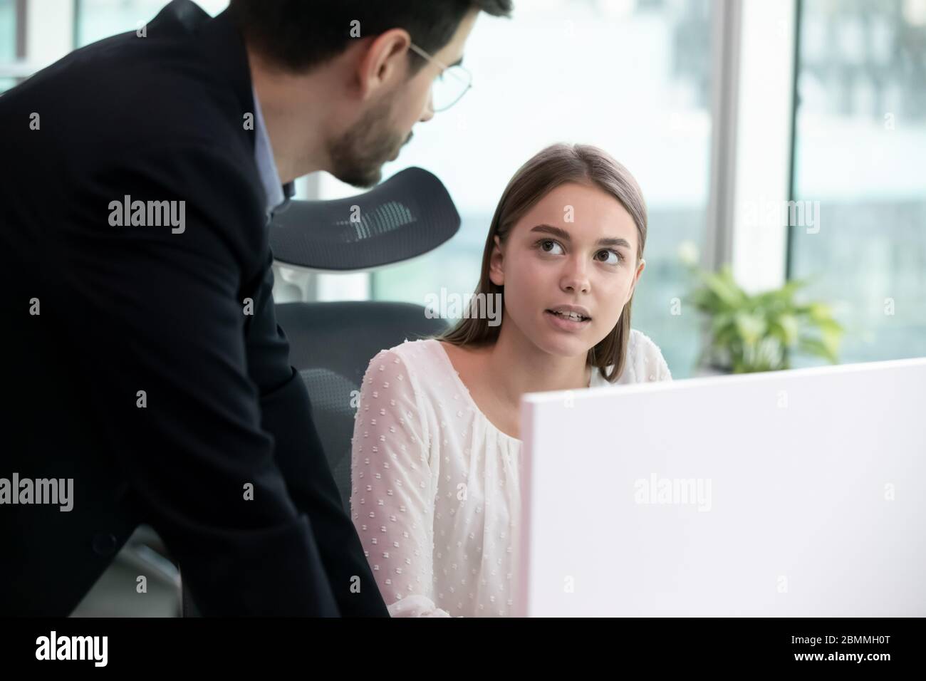 Mentor talking with apprentice discuss task provide consultation and help Stock Photo