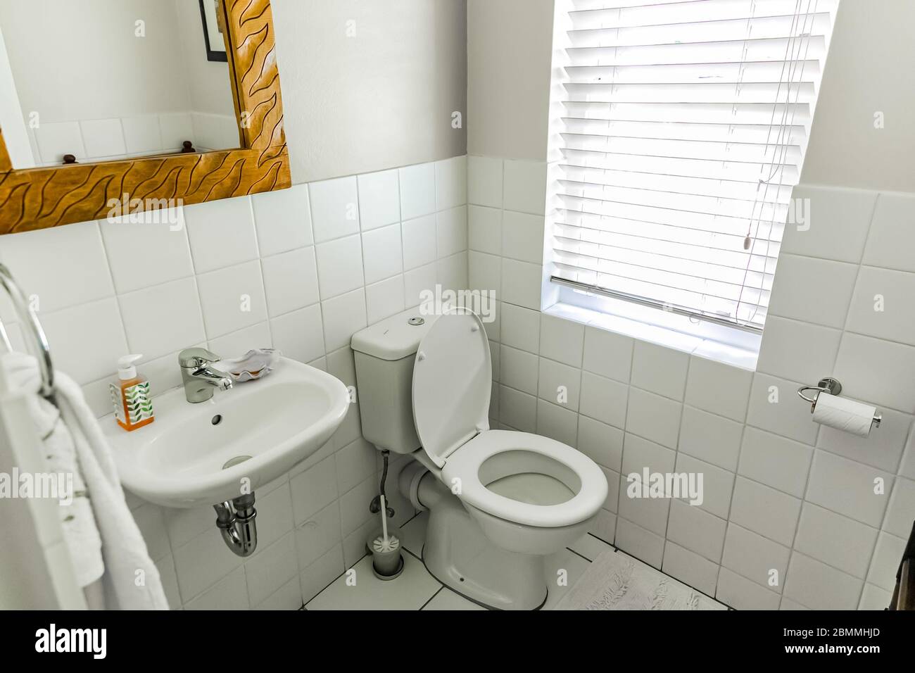 Cape Town, South Africa February 6, 2020 Inside interior of empty bathroom and toilet in up