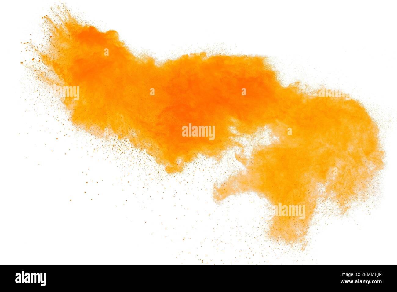 Orange powder dust particles explosion on white  background.Orange dust particles splash. Stock Photo