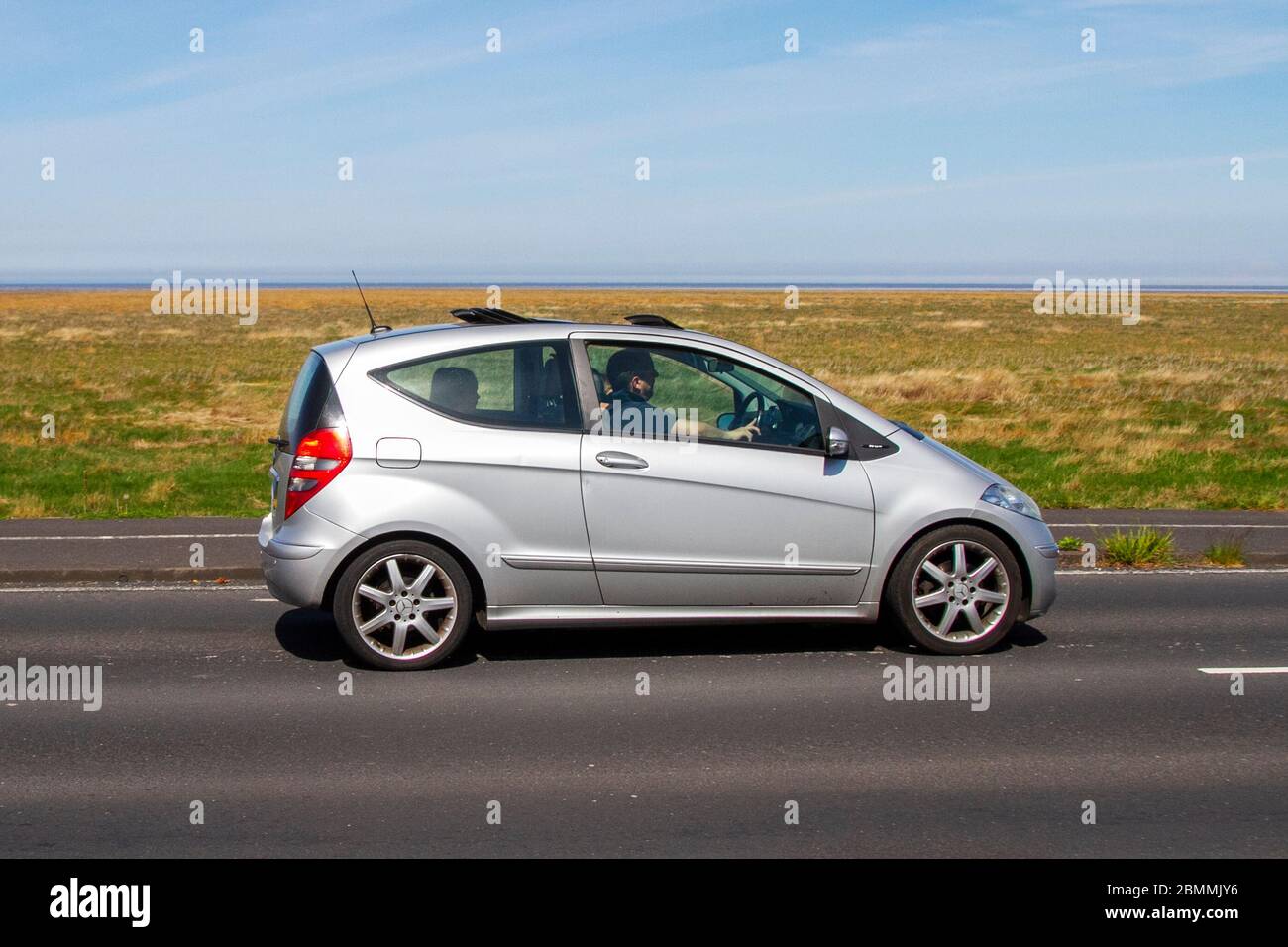 2006 silver Mercedes-Benz A-Class Hatchback A200 Avantgarde SE 5d;  Vehicular traffic moving vehicles, driving vehicle on UK roads, motors,  motoring on the coast road in Southport, UK Stock Photo - Alamy