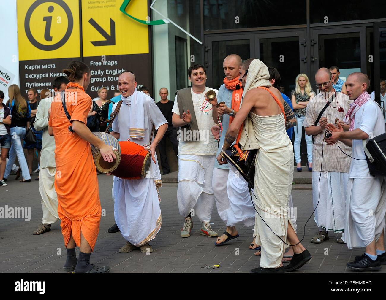 Cheerful people in Indian clothes, Hare Krishna adherents, singing and  playing drums on the street Stock Photo - Alamy