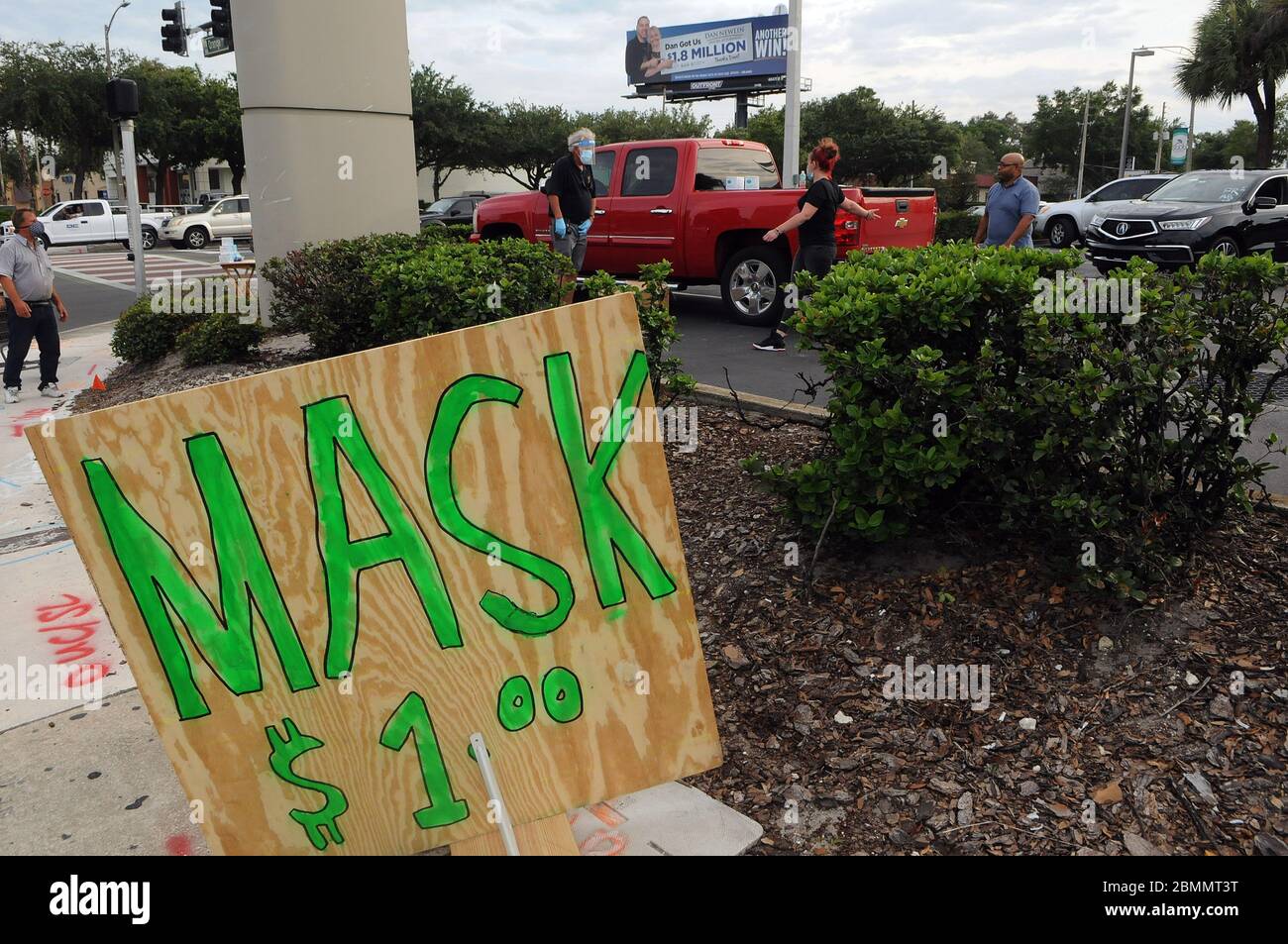Orlando, United States. 09th May, 2020. A plywood sign seen at Pete Crotty's roadside stand where he sells protective face masks during the Coronavirus (COVID-19) crisis.Crotty sold sunscreen to hotels and resorts in the Orlando area until they were forced to close due to the pandemic. Credit: SOPA Images Limited/Alamy Live News Stock Photo