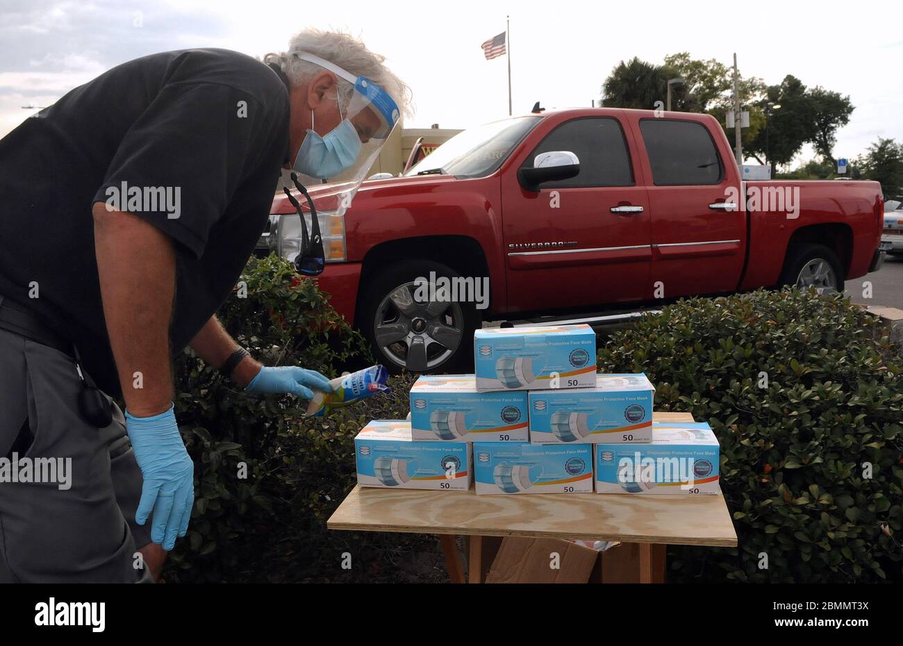 Orlando, United States. 09th May, 2020. Pete Crotty displays his merchandise on a small table at a roadside stand where he sells protective face masks during the Coronavirus (COVID-19) crisis.Crotty sold sunscreen to hotels and resorts in the Orlando area until they were forced to close due to the pandemic. Credit: SOPA Images Limited/Alamy Live News Stock Photo