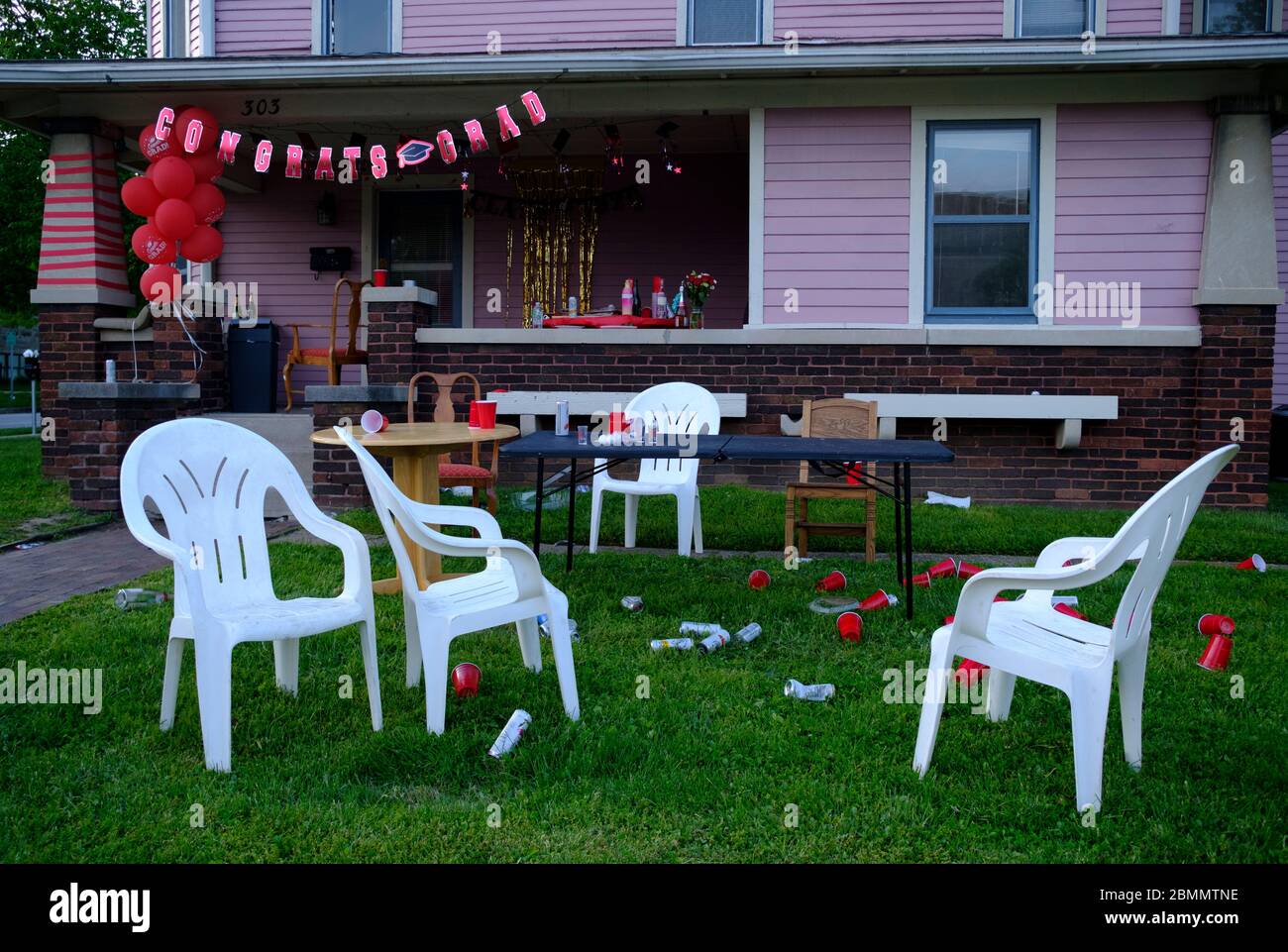 Bloomington, United States. 09th May, 2020. Empty cups, and cans litter a lawn after a college graduation party.Classes at IU were taught virtually since spring break due to the COVID-19/Coronavirus pandemic, and in person classes were cancelled and the in person annual graduation ceremony was also cancelled. Credit: SOPA Images Limited/Alamy Live News Stock Photo