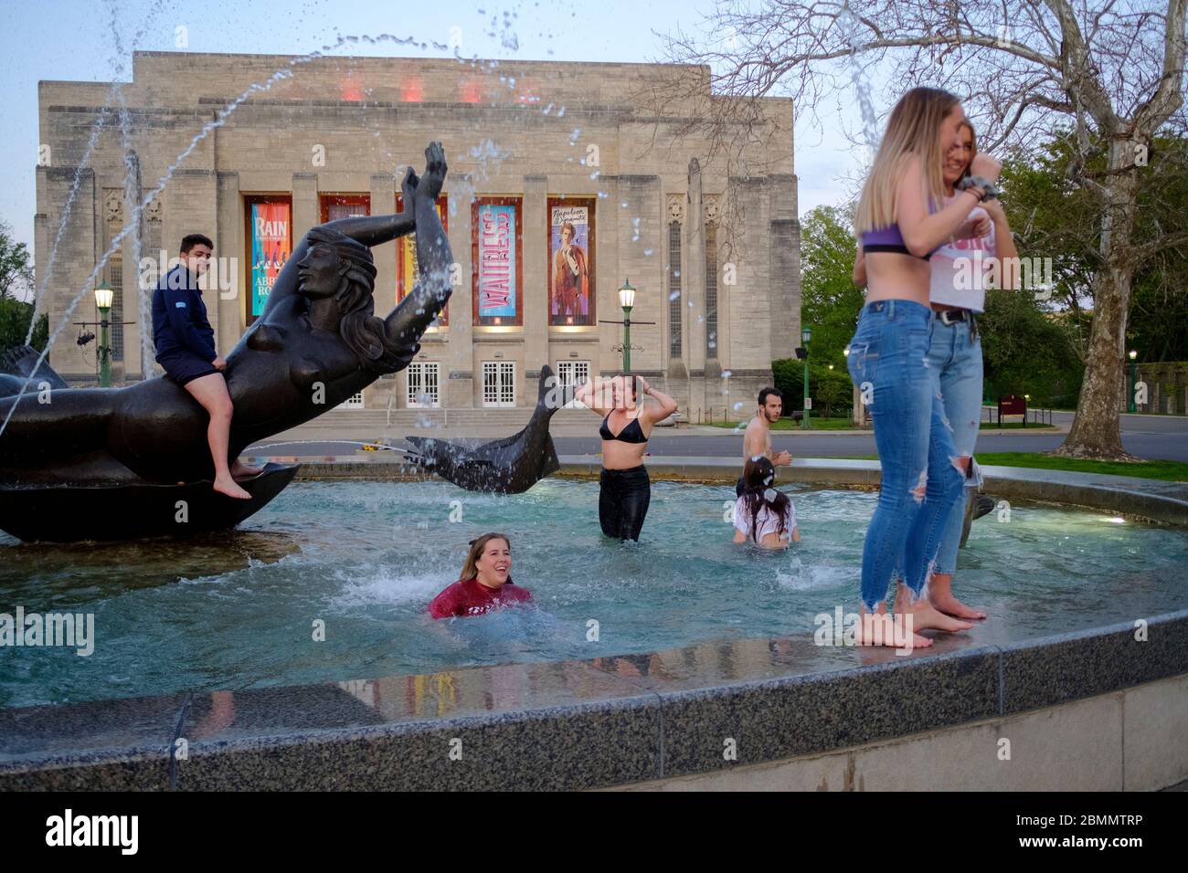 Bloomington, United States. 09th May, 2020. A group of Indiana University students who just finished graduating from the Kelley School of business during a video ceremony this weekend celebrate afterwards by jumping into waters of the Show-alter Fountain and posing for photographs.Classes at IU were taught virtually since spring break due to the COVID-19/Coronavirus pandemic, and in person classes were cancelled and the in person annual graduation ceremony was also cancelled. Credit: SOPA Images Limited/Alamy Live News Stock Photo