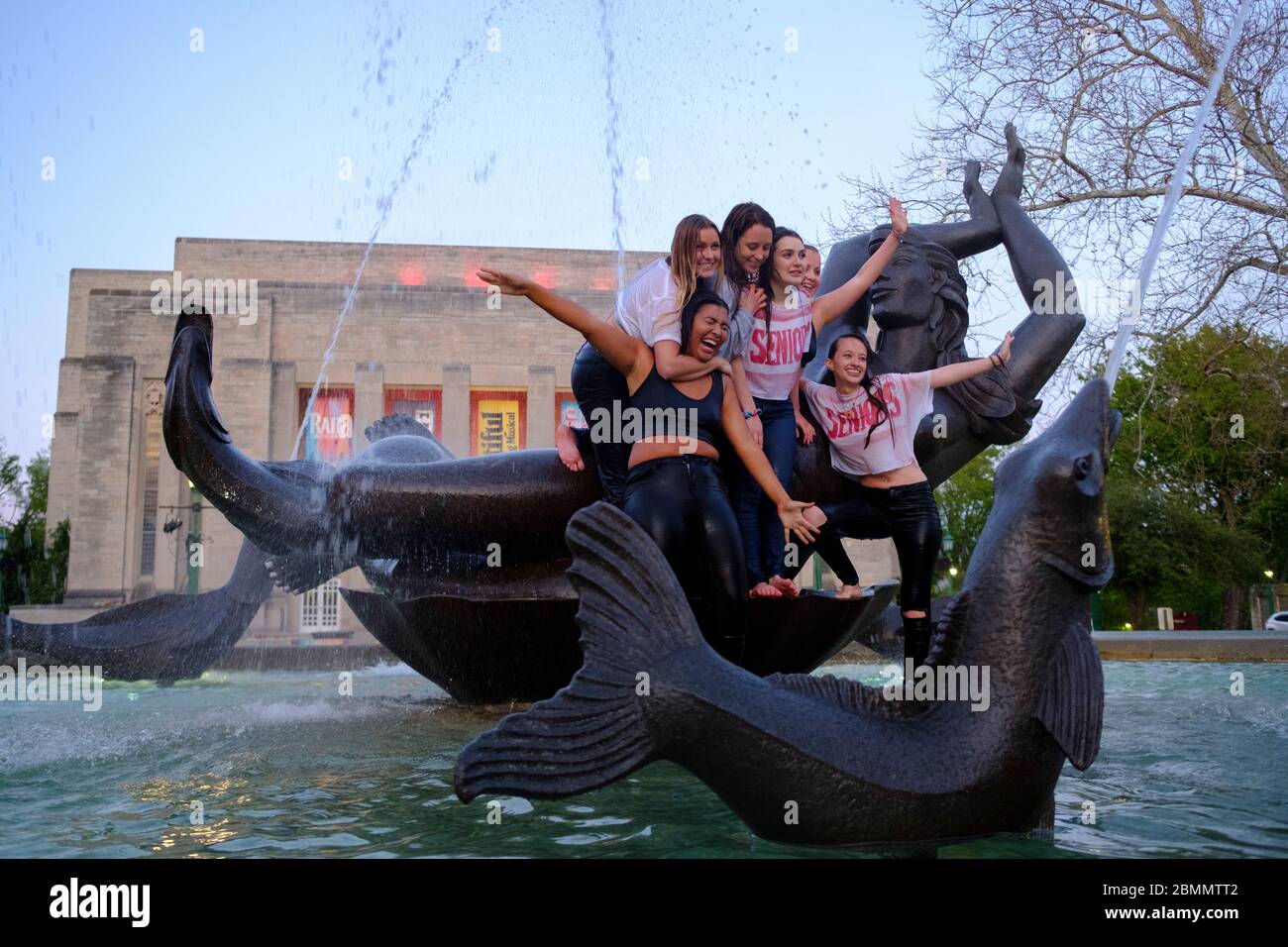 Bloomington, United States. 09th May, 2020. A group of Indiana University students who just finished graduating from the Kelley School of business during a video ceremony this weekend celebrate afterwards by jumping into waters of the Show-alter Fountain and posing for photographs.Classes at IU were taught virtually since spring break due to the COVID-19/Coronavirus pandemic, and in person classes were cancelled and the in person annual graduation ceremony was also cancelled. Credit: SOPA Images Limited/Alamy Live News Stock Photo