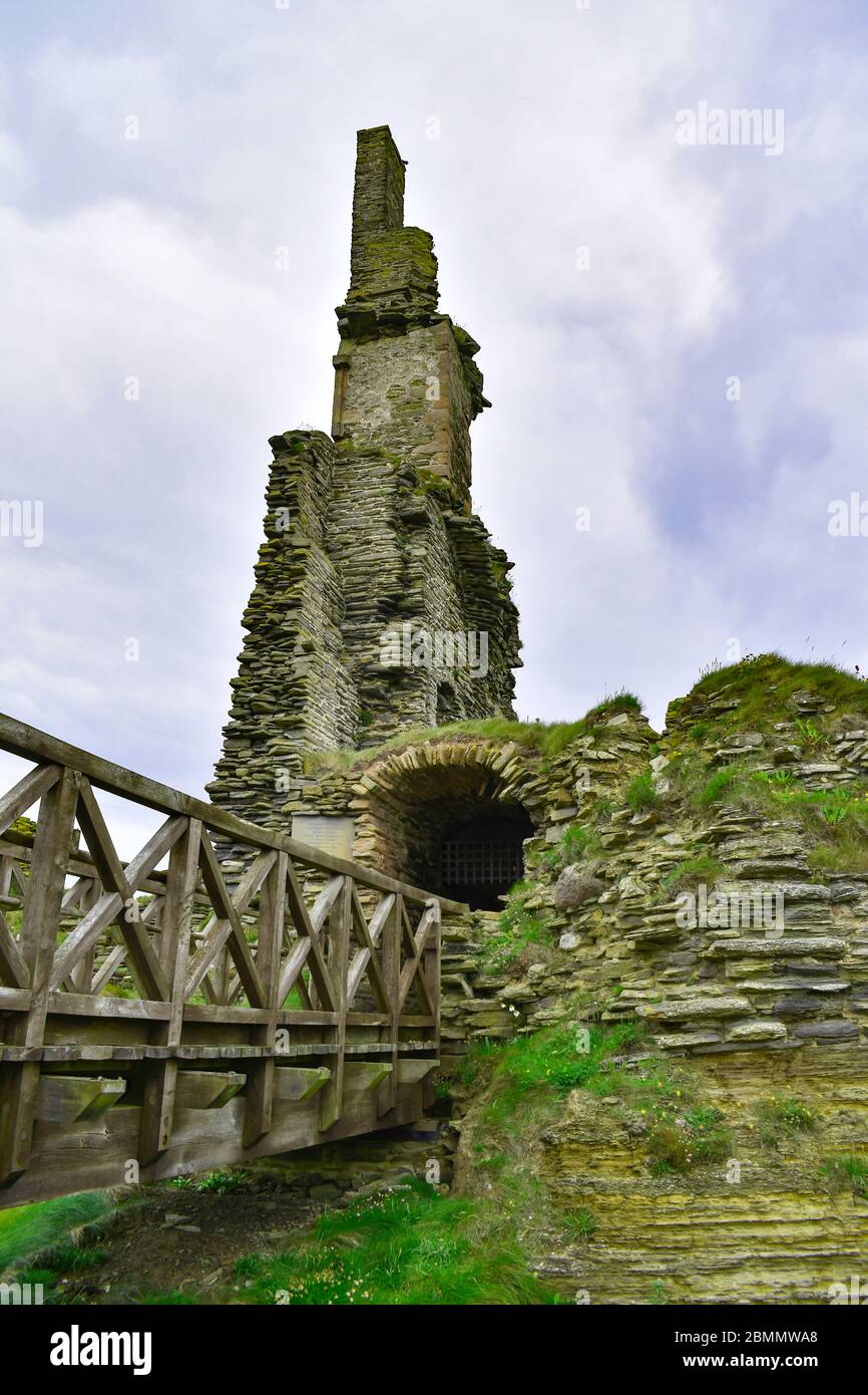 Ruins of Castle Sinclair near Wick, Caithness Scotland, wooden bridge leading to stone ruins of castle. On route of North Coast 500. Stock Photo