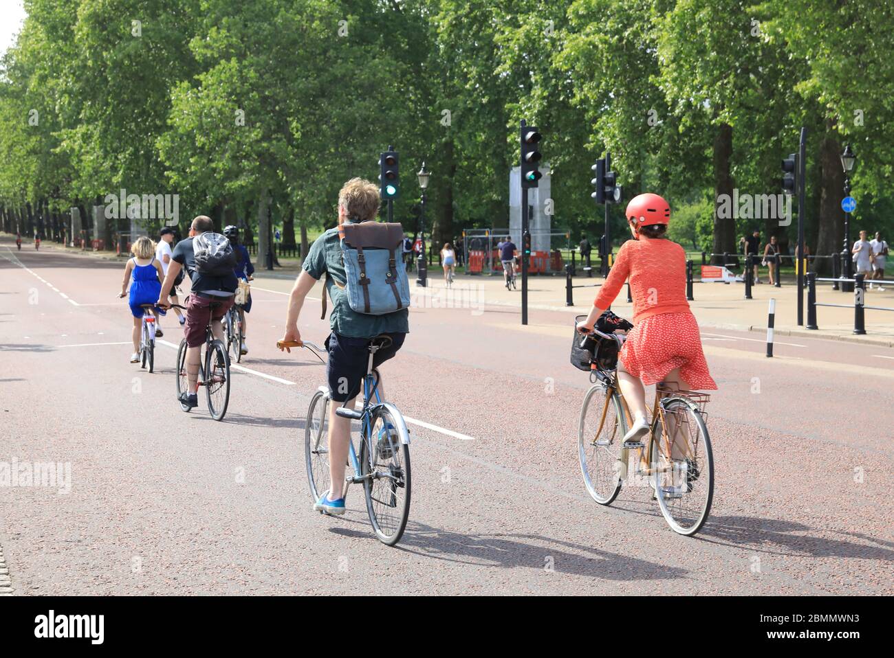 Lots of people cycling down the Mall in the good weather over the VE Day bank holiday weekend, anticipating a slight lifting of lockdown restrictions in the coronavirus, in central London, UK Stock Photo