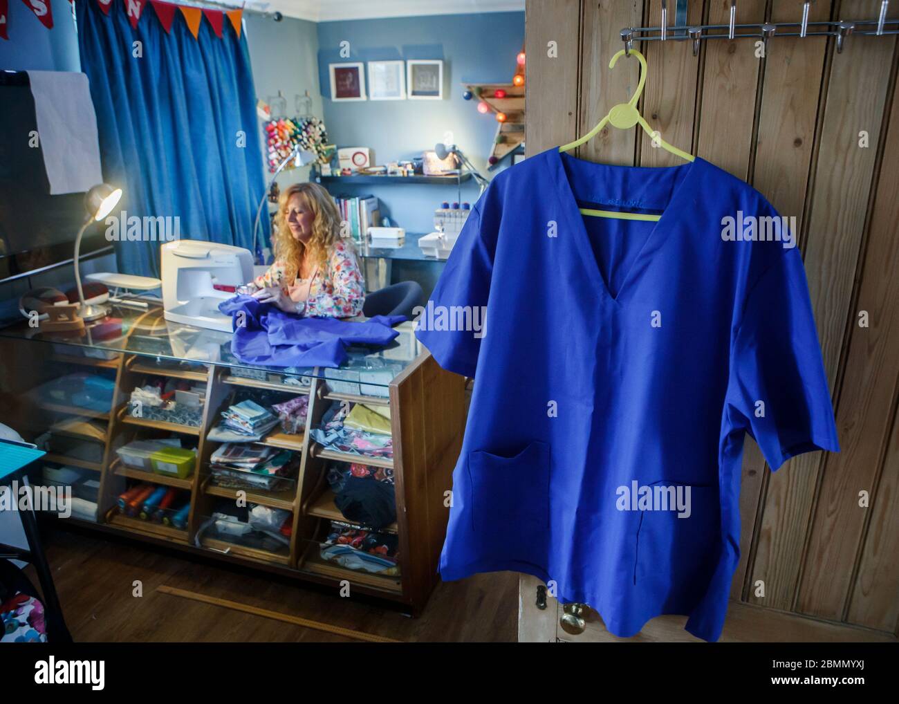 Seamstress Jen Legg, who has made scrubs for frontline workers with the messages 'You are loved' sewn in them, at her home in Maltby in North Yorkshire, as the UK continues in lockdown to help curb the spread of the coronavirus. Stock Photo