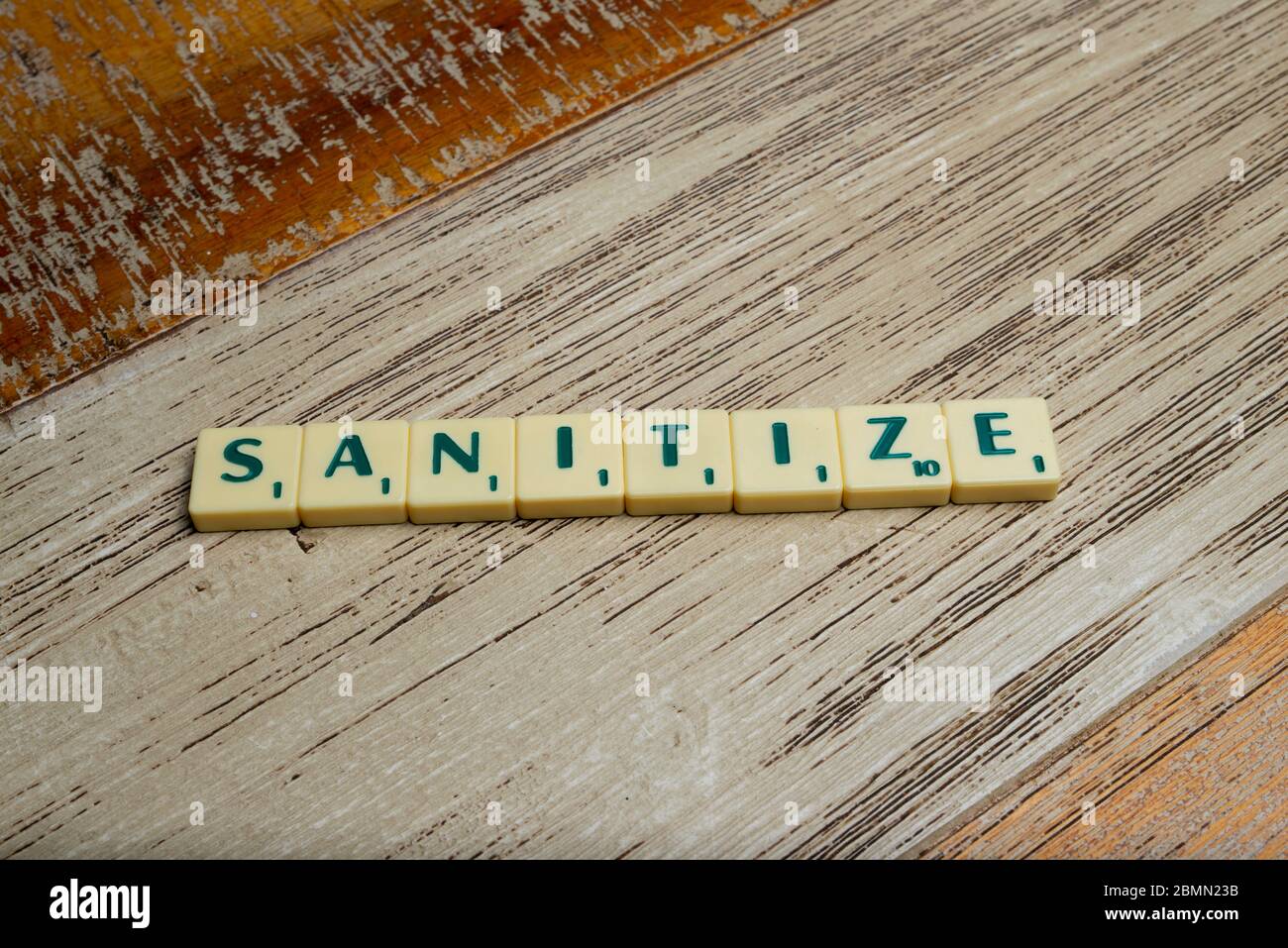 Sanitize flat lay tile letters Stock Photo