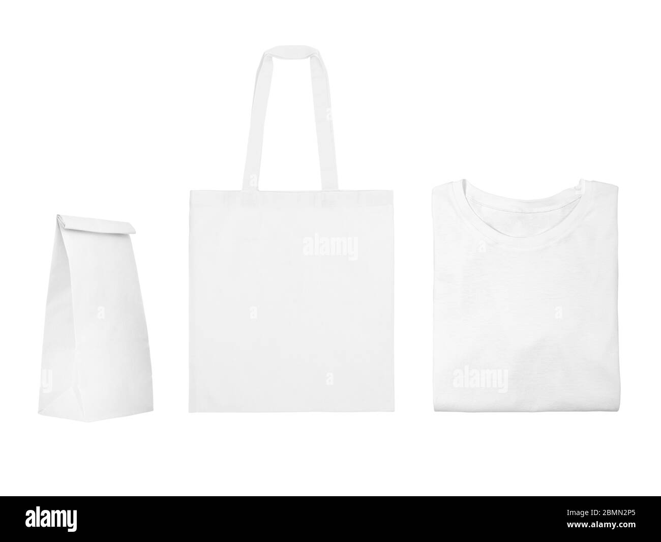 Collection of white objects isolated on white background. White cotton bag, white folded t-shirt, paper bag package Stock Photo