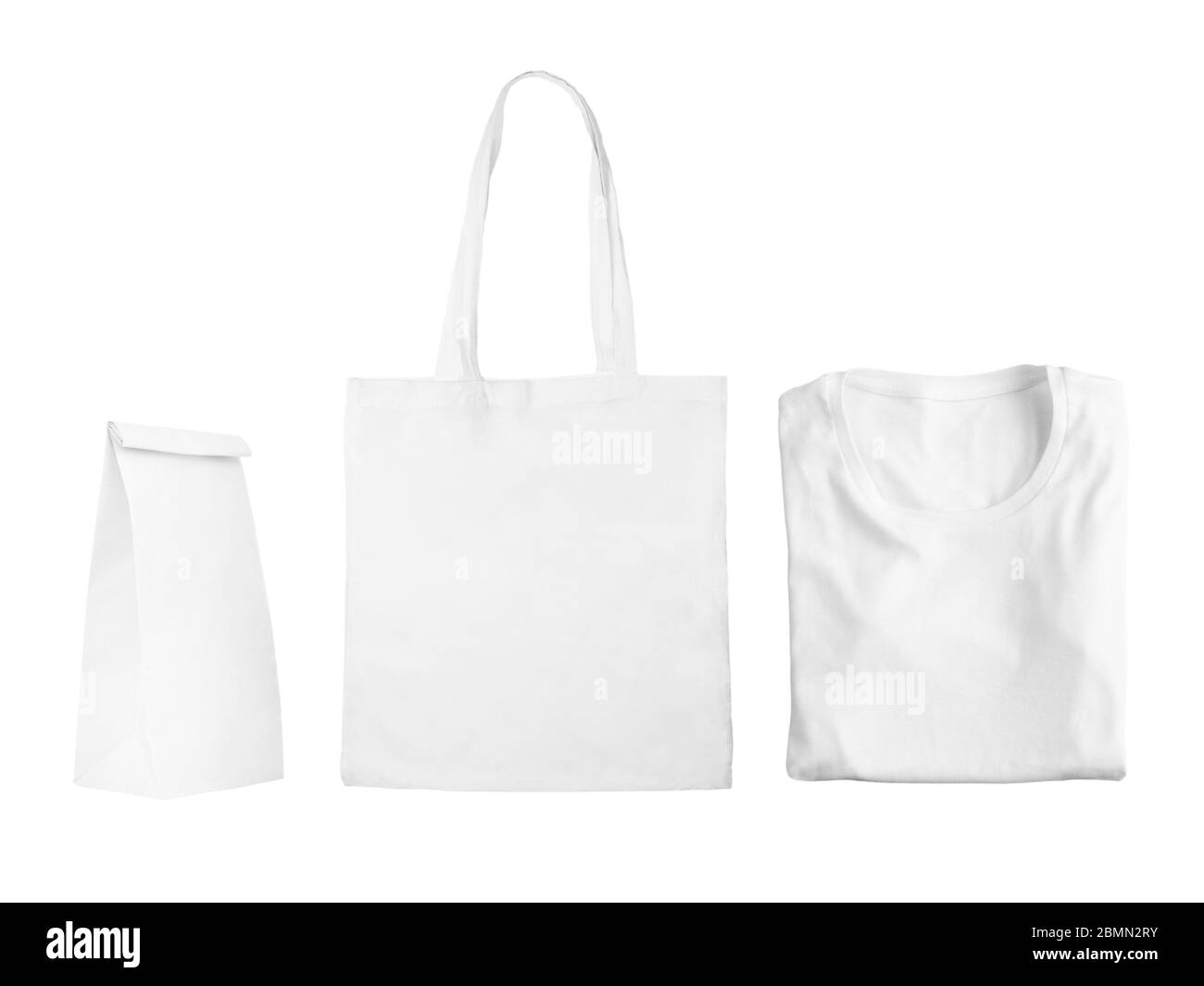 Collection of white objects isolated on white background. White cotton bag, white folded t-shirt, paper bag package. Flat lay Stock Photo
