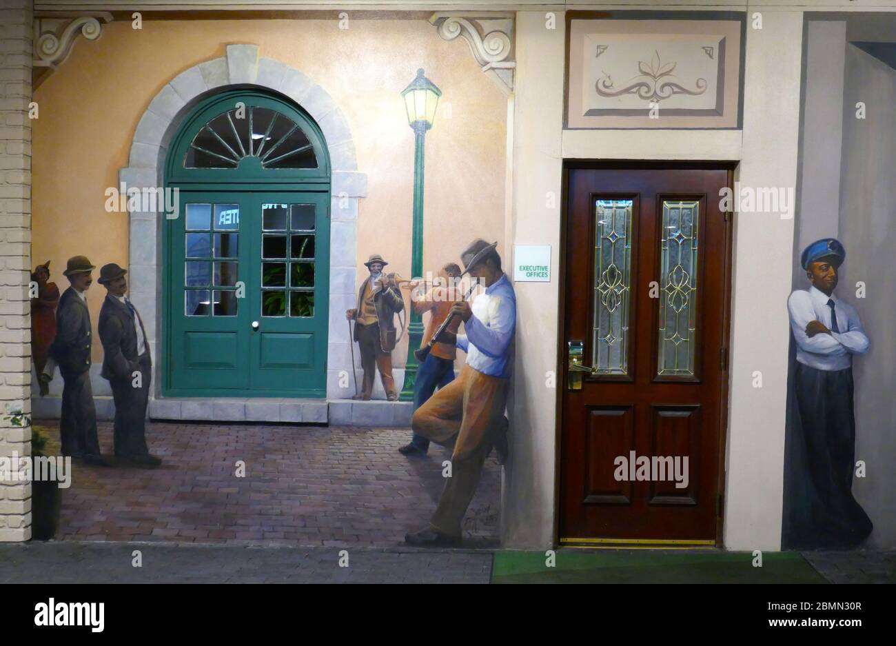 Mural on side of Courtyard Cafe in the French Quarter of New Orleans, Louisiana, USA Stock Photo