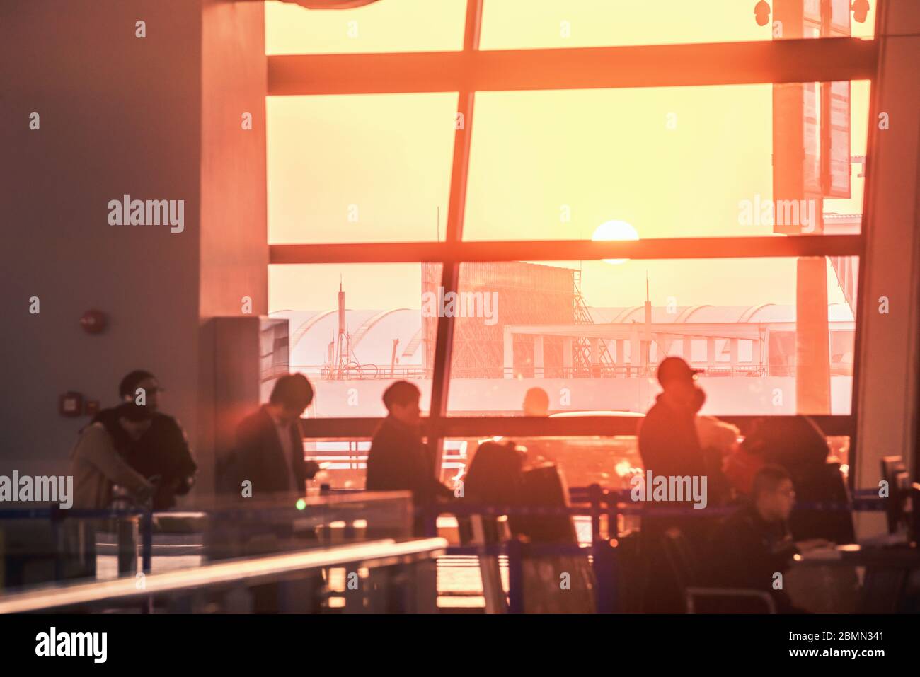 Blur people walking in airport at sunset Stock Photo - Alamy