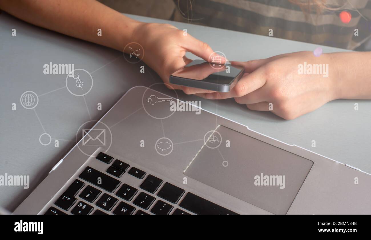young woman shopping  on line, Using smart phone and laptop computer. Stock Photo
