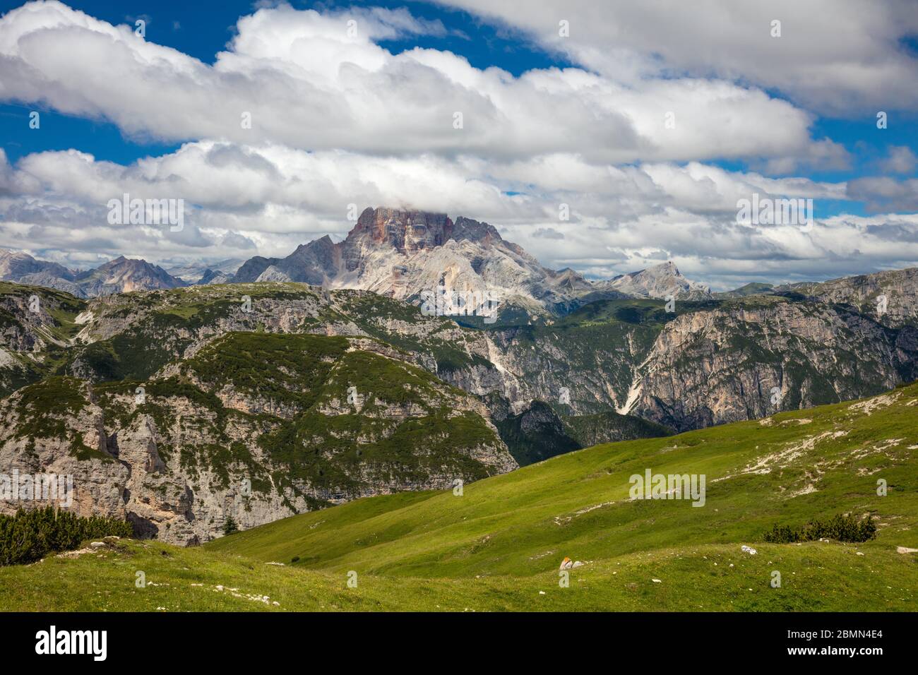 Sunny Mountain Landscape with big peaks of Dolomites whith blue sky and grass valley, Passo di Giau,  Alps, Italy, Europe. Stock Photo