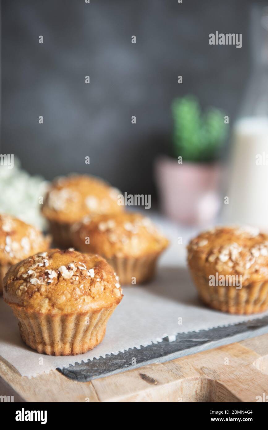 Fresh homemade delicious carrot muffins decorated with oat flakes and
