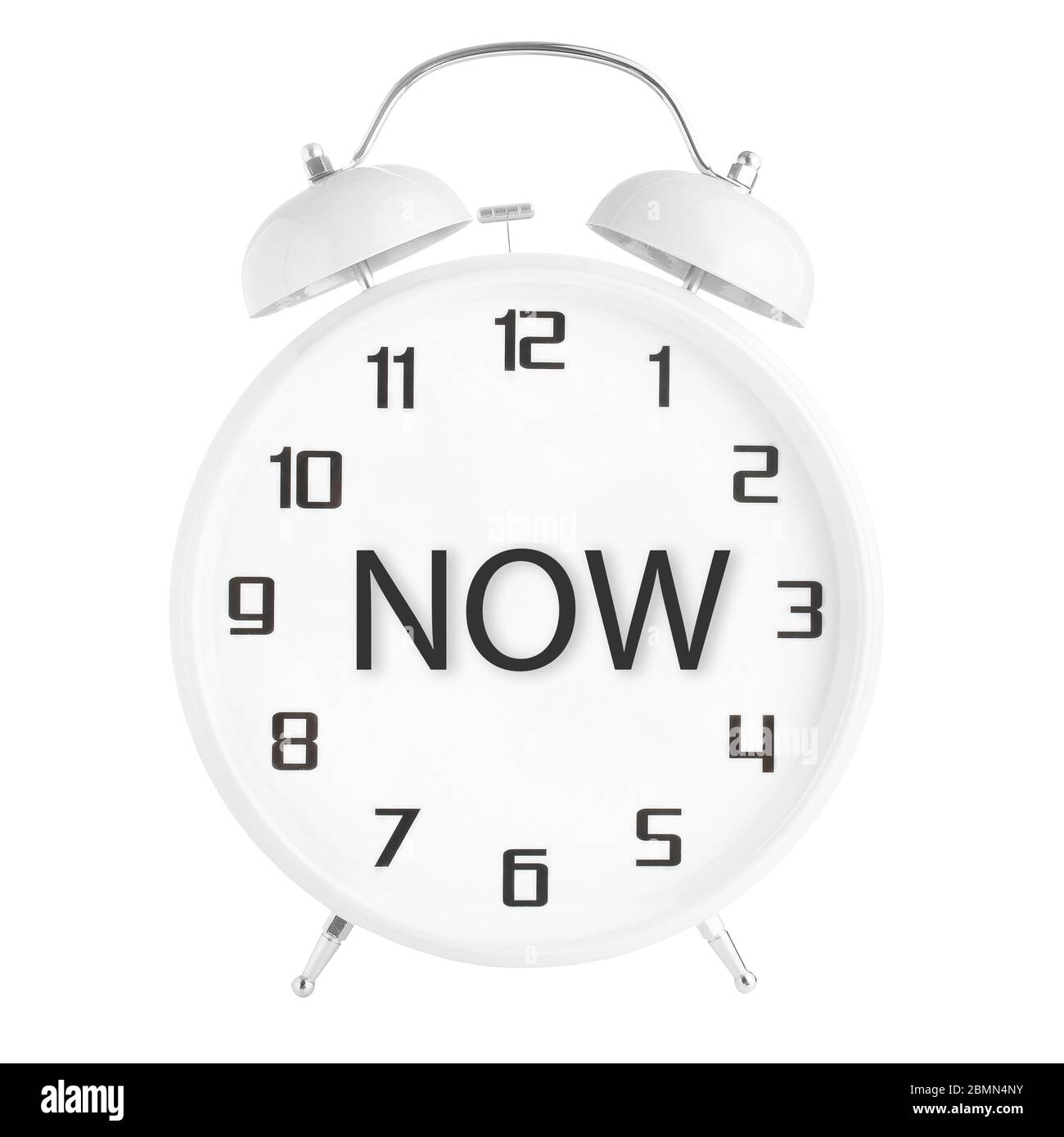 White old fashioned alarm clock with word now on clock face isolated on