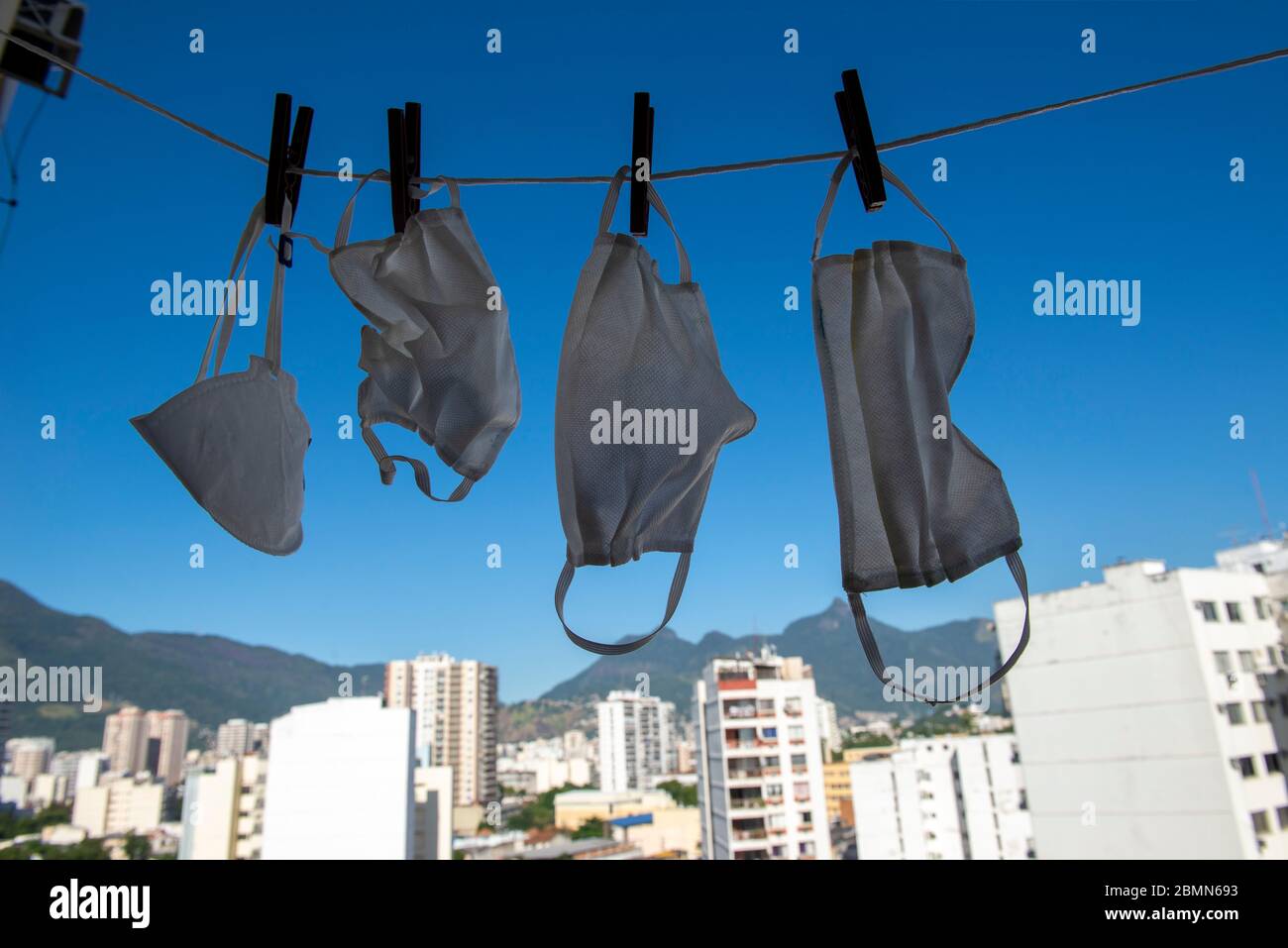 masks drying after washing to sterilize covid-9 in a apartment balcony Stock Photo