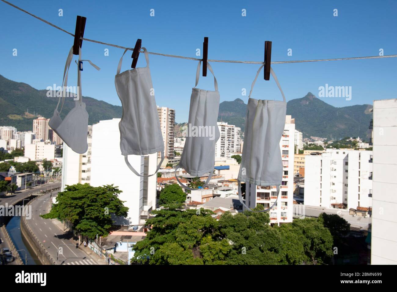 masks drying after washing to sterilize covid-9 in a apartment balcony Stock Photo