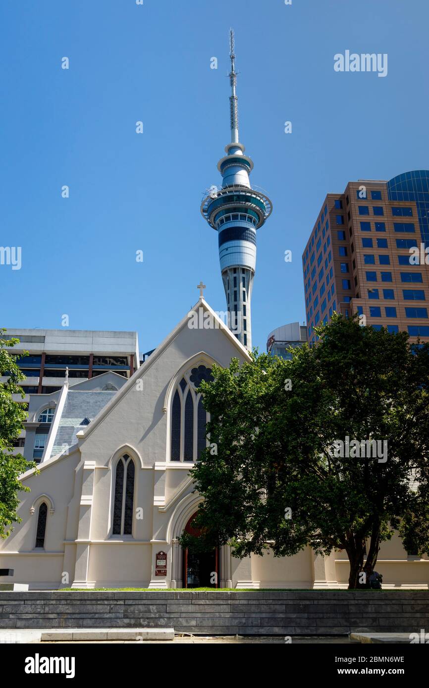 1908 Catholic Cathedral of St Patrick and St Joseph, Wyndham Street, Auckland, New Zealand. The Sky Tower in the background. Stock Photo