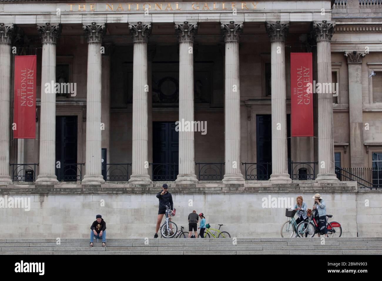 London, UK: sight-seers and cyclists in Trafalgar Square stop for photos and mostly manage to follow social-distancing advice. Prime Minister Boris Johnson is poised to announce some relaxation of the rules. Anna Watson/Alamy Live News Stock Photo