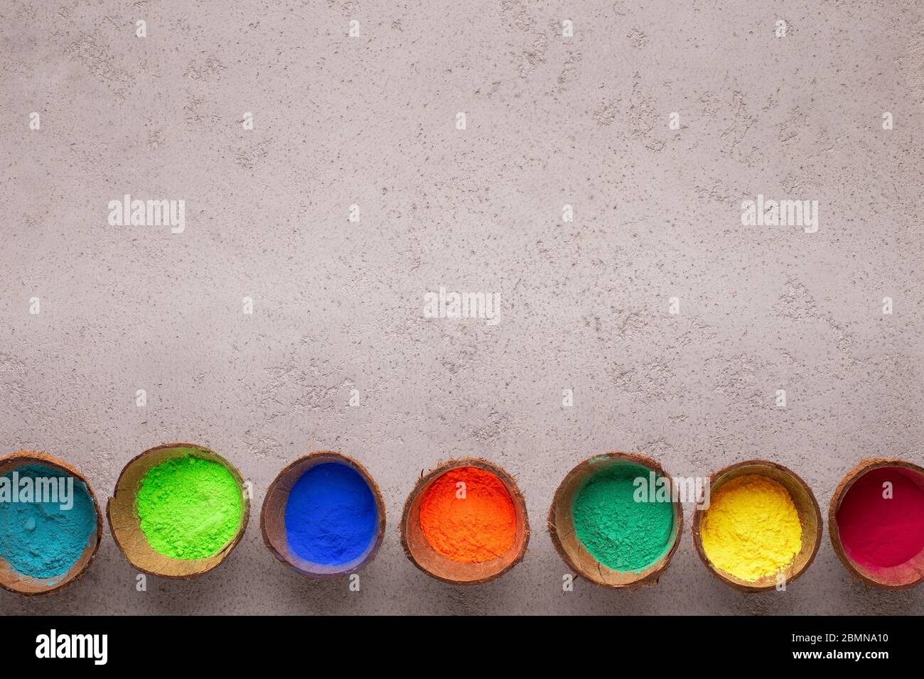 A lot of bright powders of colors in coconuts for festival Stock Photo ...