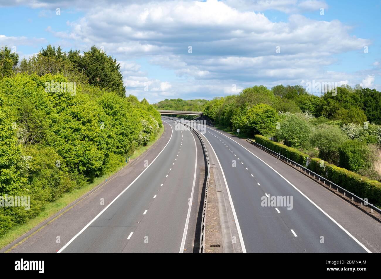 Clear motorway has no traffice in both directions. Stock Photo