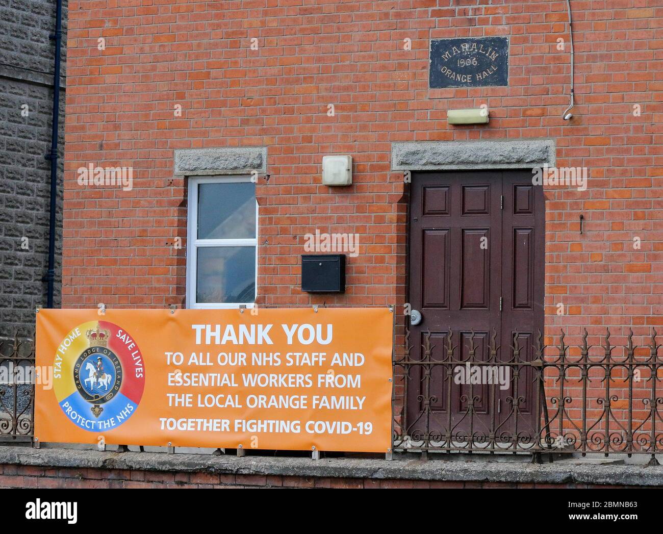 Magheralin, County Armagh, Northern Ireland. 10 May 2020. UK weather - cooler and breezy in the north-easterly wind but a very pelasant spring day nonetheless. NHS and essential workers "Thank You" banner outside the local orange lodge hall.  "ThankCredit: CAZIMB/Alamy Live News. Stock Photo