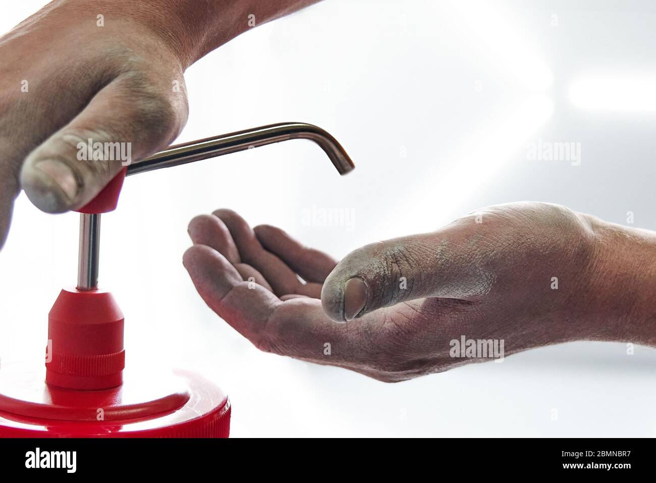 Mechanic applying washing soap to clean dirty hands after work Stock Photo  by ©mariakray 371272872